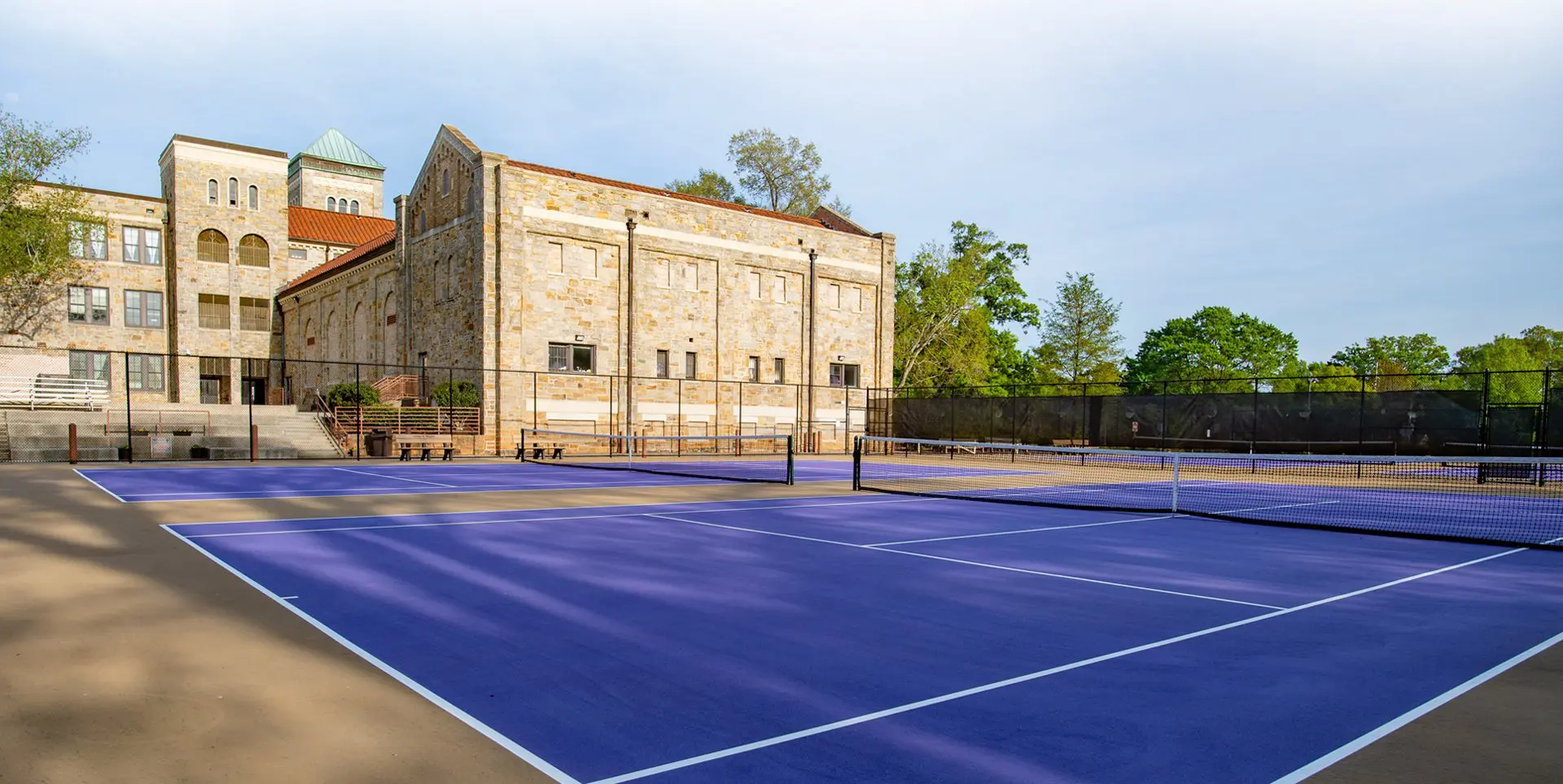 A tennis court with blue and white lines